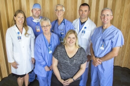Left to right, with Heather Miller in the center, Dr. Elisabeth Revoir, Endoscopy Nursing Assistant Cindy Hunt, Nurse Anesthetist Nate Palm, Dr. Norman Boucher, Dr. Morgan Althoen, and Dr. Jonathan Shultz